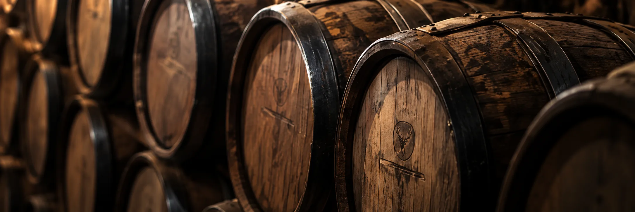 Oak casks stacked in a warehouse